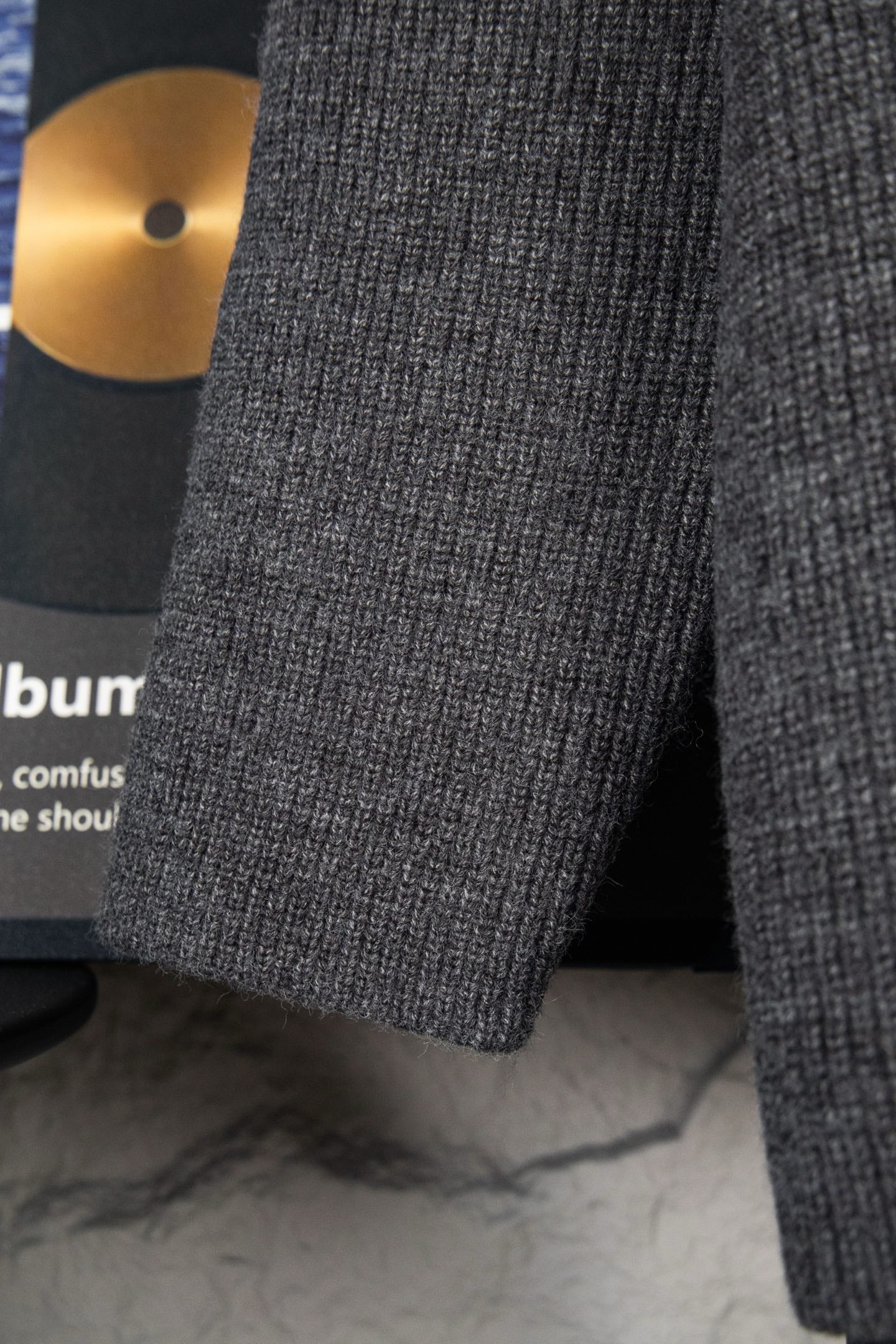 Dark gray knit sweater sleeve and ribbed cuff