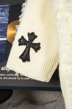 Off-white knit sweater sleeve with black clover cross applique
