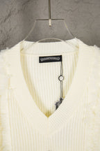 Off-white V-neck knit sweater collar with brand label and hanging tag detail