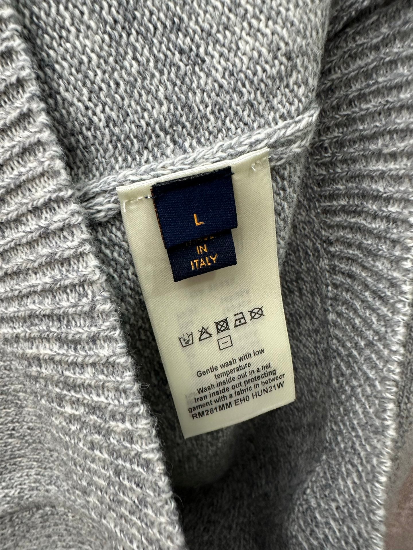 Clothing care label on Louis Vuitton knit sweater, Made in Italy
