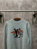 Louis Vuitton knit sweater front close-up in light blue with logo graphic