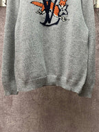 Louis Vuitton knit sweater lower front view in light blue with logo graphic