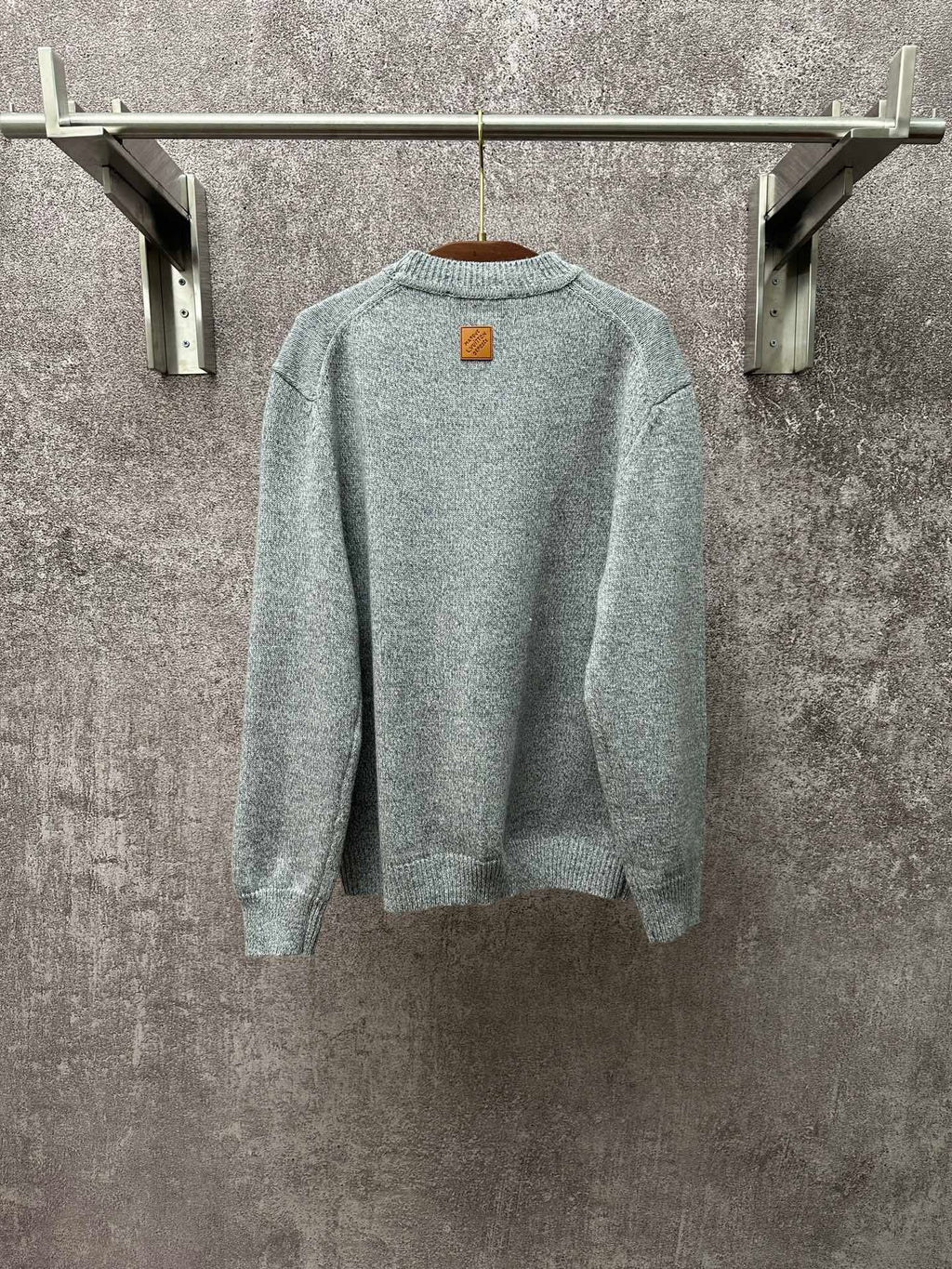 Louis Vuitton knit sweater back view in light blue with small logo patch