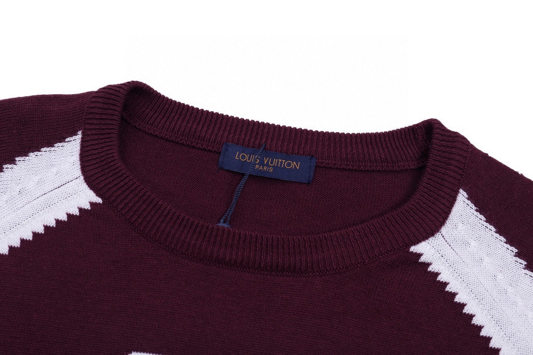 Burgundy crewneck T-shirt with white chevron trim and blue brand label