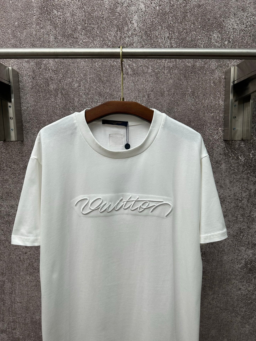Louis Vuitton white short-sleeve T-shirt with centered chest script logo