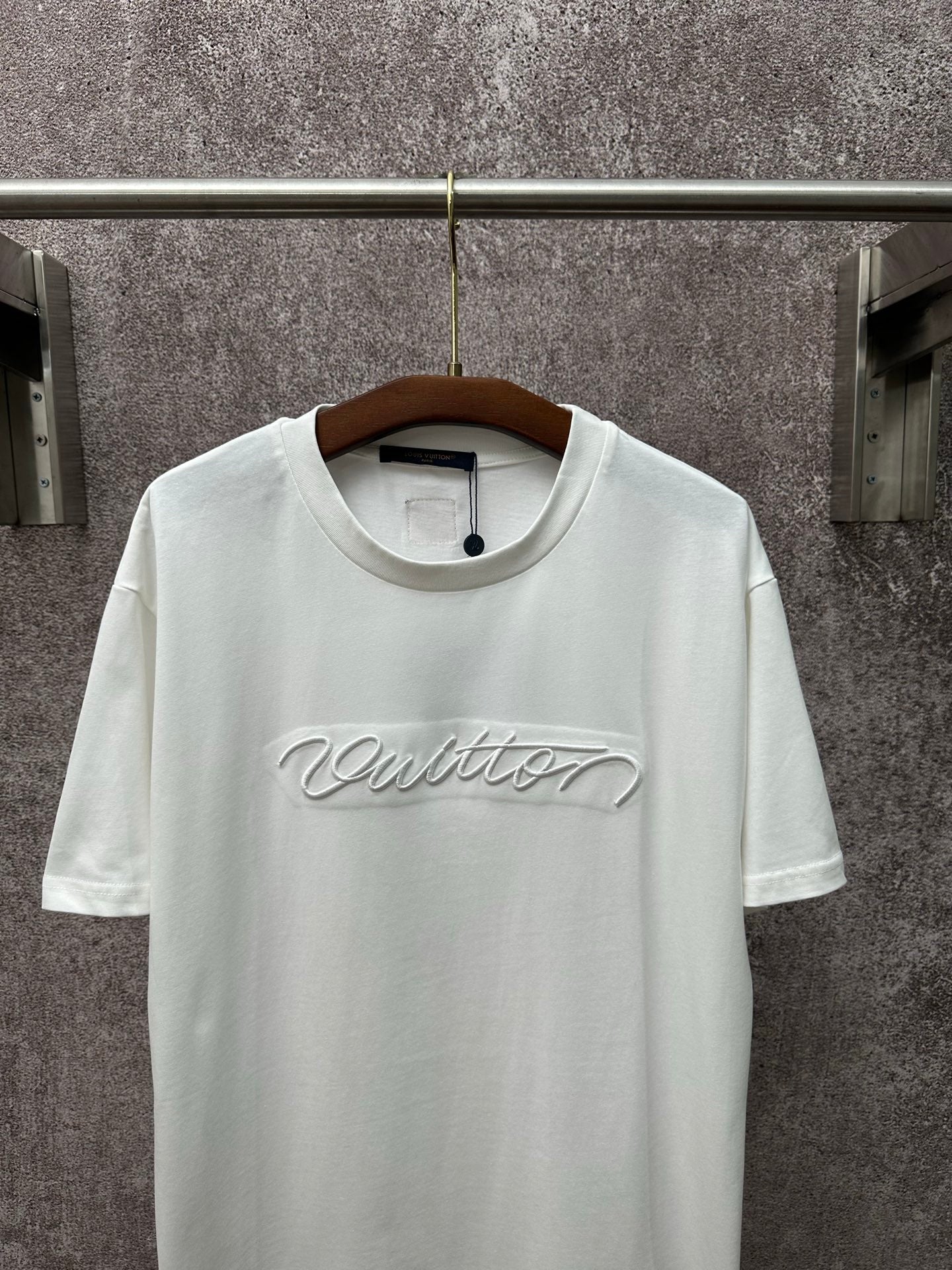 Louis Vuitton white short-sleeve T-shirt with centered chest script logo