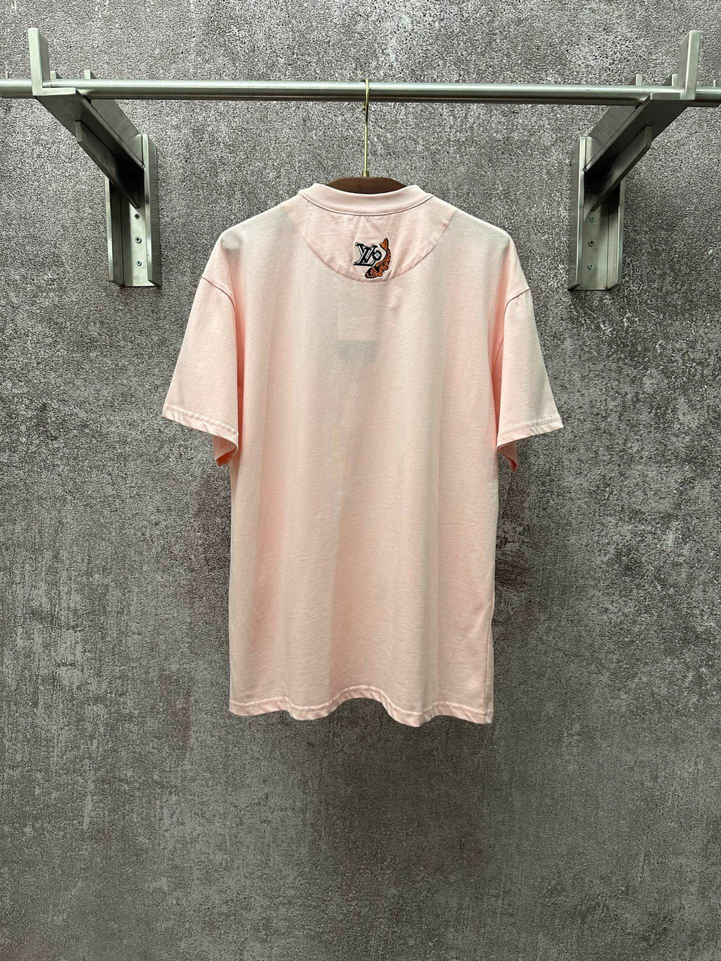 Louis Vuitton pale pink T-shirt with small LV emblem on back, crew neck, short sleeves