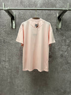 Louis Vuitton pale pink T-shirt with small LV emblem on back, crew neck, short sleeves