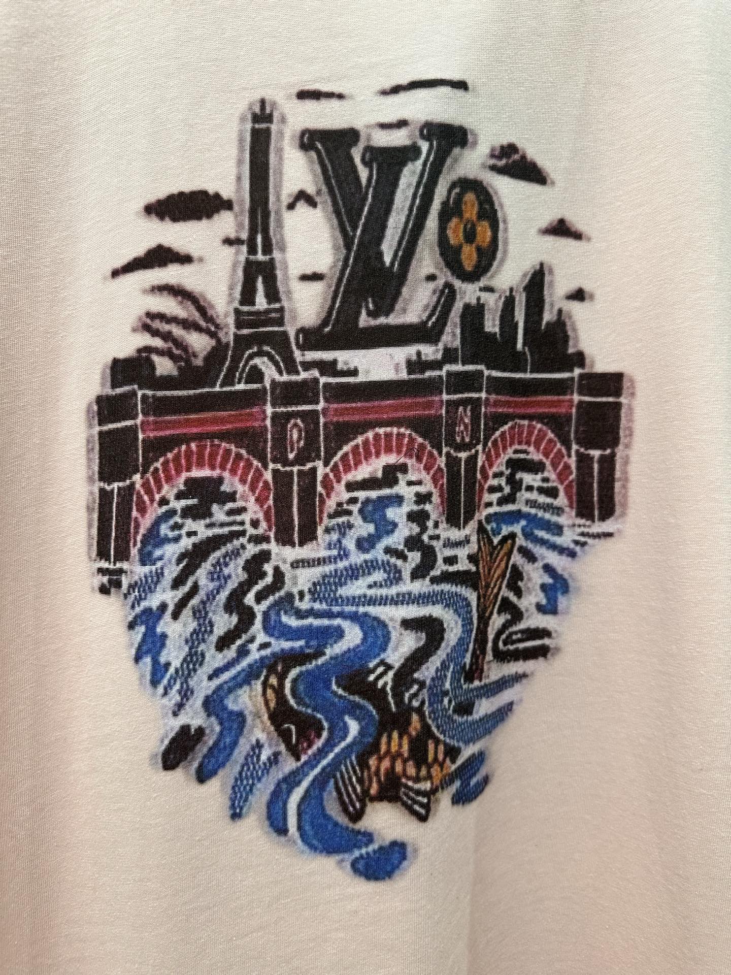 Louis Vuitton LV logo graphic on pale pink T-shirt with blue flame artwork