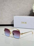 Dior sunglasses with gold-tone frame and purple gradient lenses