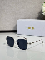 Dior sunglasses with silver-tone frame and dark blue lenses