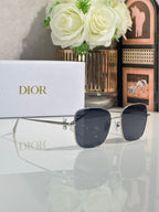 Dior sunglasses with dark lenses and clear shield arms