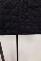 Black quilted jacket back with button placket and diamond stitching
