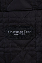 Black quilted jacket interior label reading Christian Dior Couture
