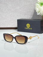 Versace black sunglasses with gold-tone arms and tinted brown lenses