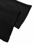 Black Dior pants hem with cuffed bottom and visible stitching