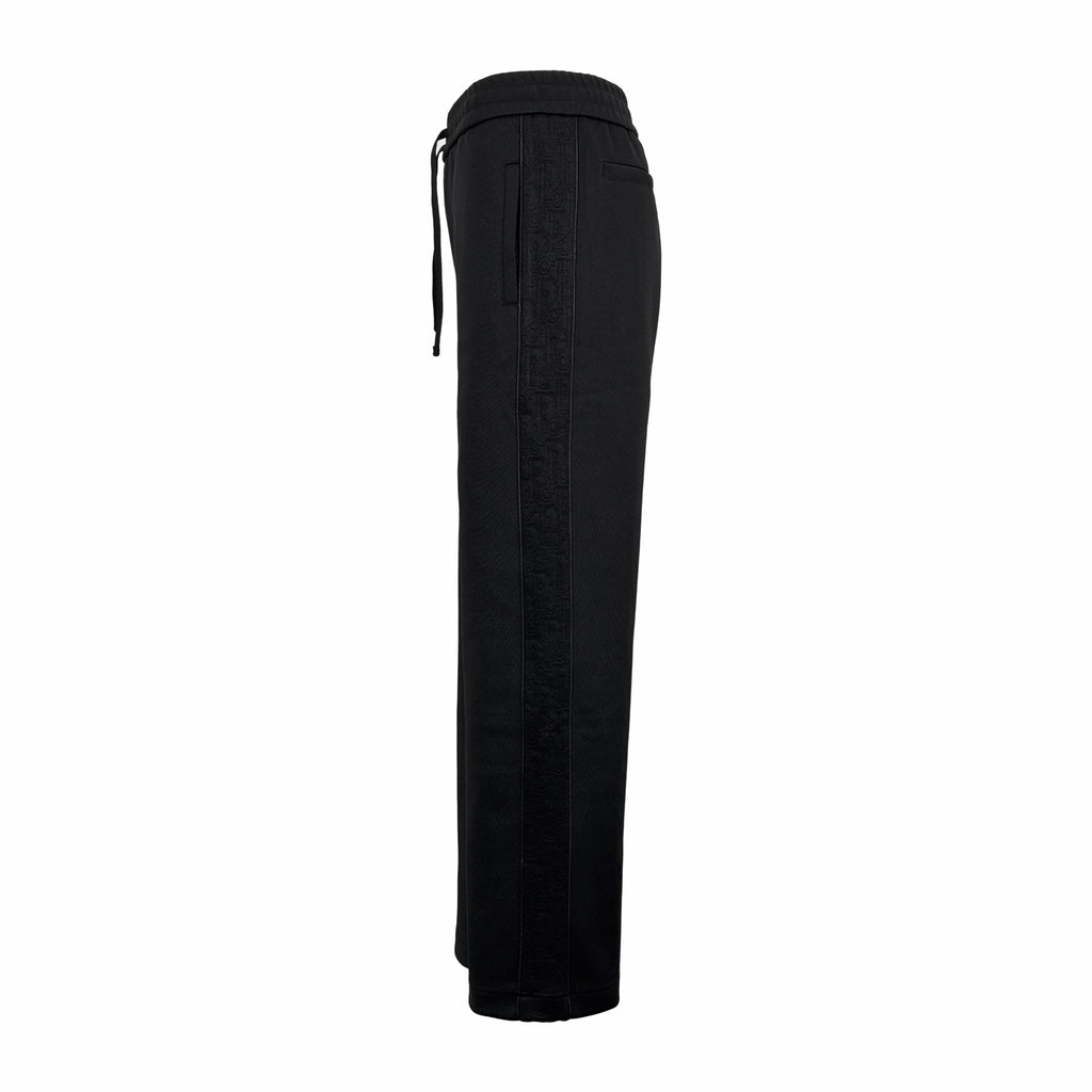 Black wide-leg Dior pants with side ties and zip fly