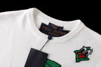 White crew-neck T-shirt close-up of collar ribbing and Louis Vuitton tag
