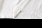 White T-shirt hem and side seam close-up