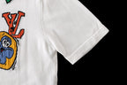 White T-shirt sleeve and side seam with partial graphic