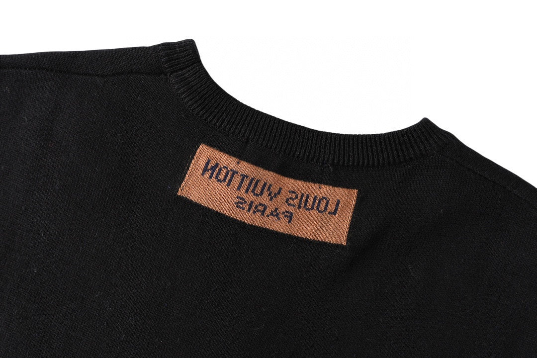 Black T-shirt neck label with brown tag text