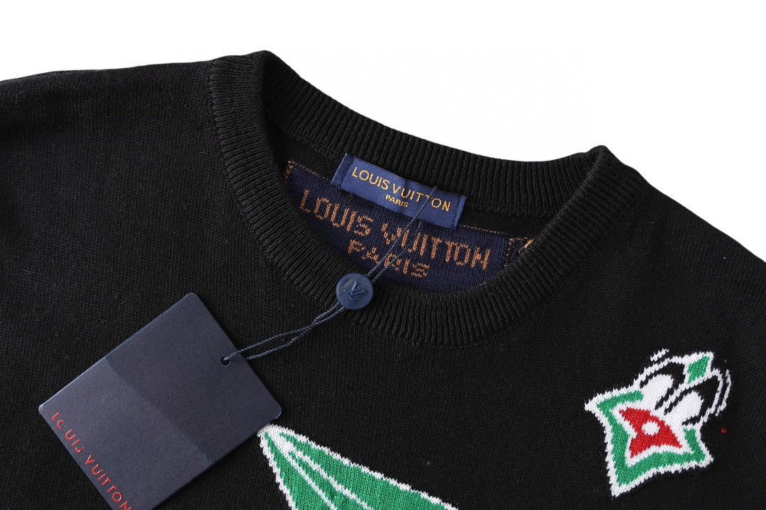 Black T-shirt neckline with blue button and Louis Vuitton neck tag