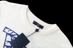Louis Vuitton T-shirt collar close-up, white knit with blue logo patch at neckline