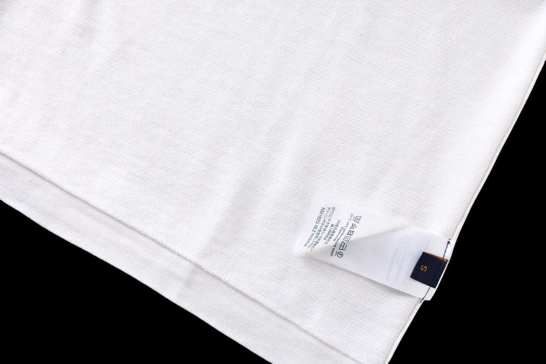 White T-shirt fabric close-up with care label near hem