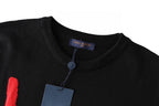 Black graphic T-shirt neckline close-up with hanging blue price tag