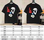 Two black graphic T-shirts with red, blue, and white face print shown side by side