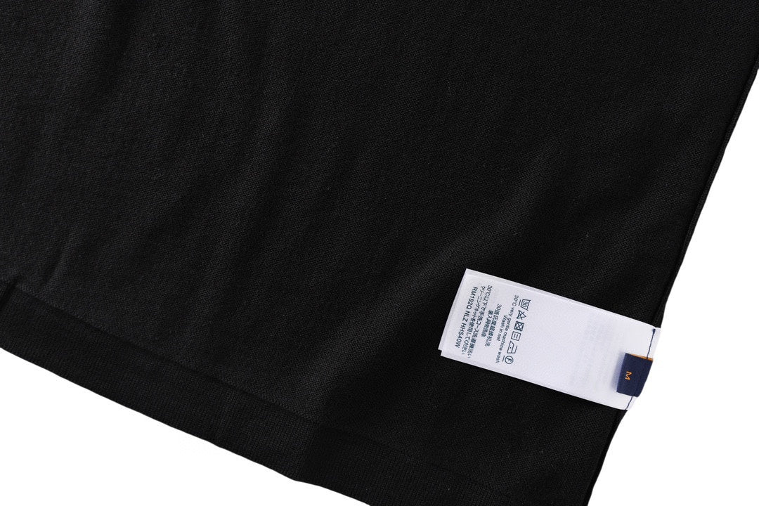 Black T-shirt with white size label at hem