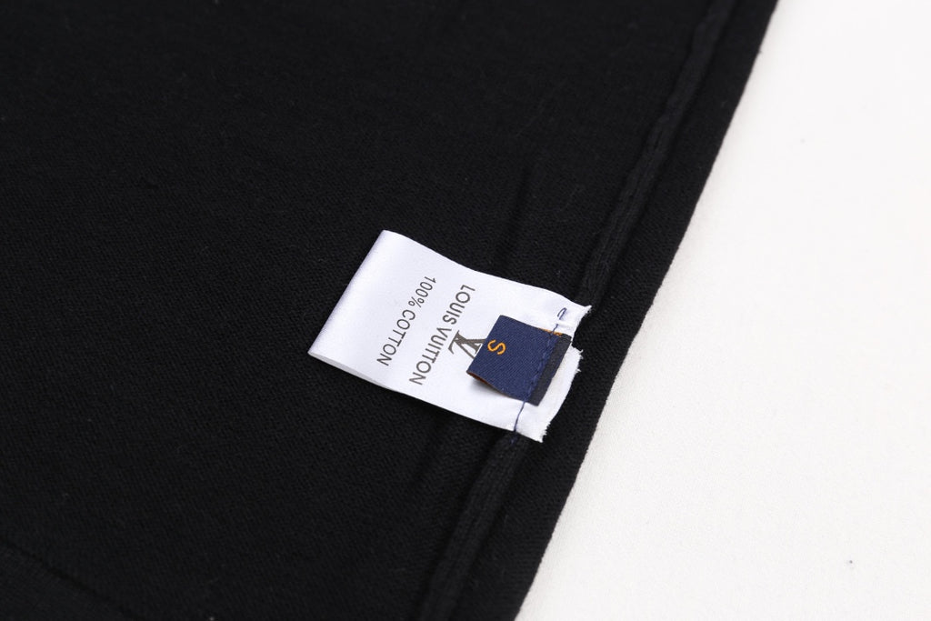 Black T-shirt with fabric tag on side hem