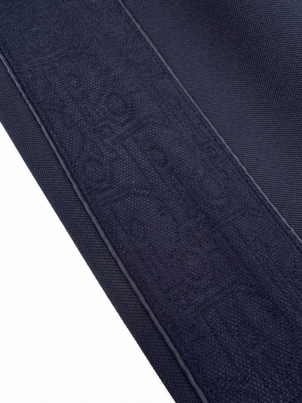 Navy textured woven fabric with visible side seam