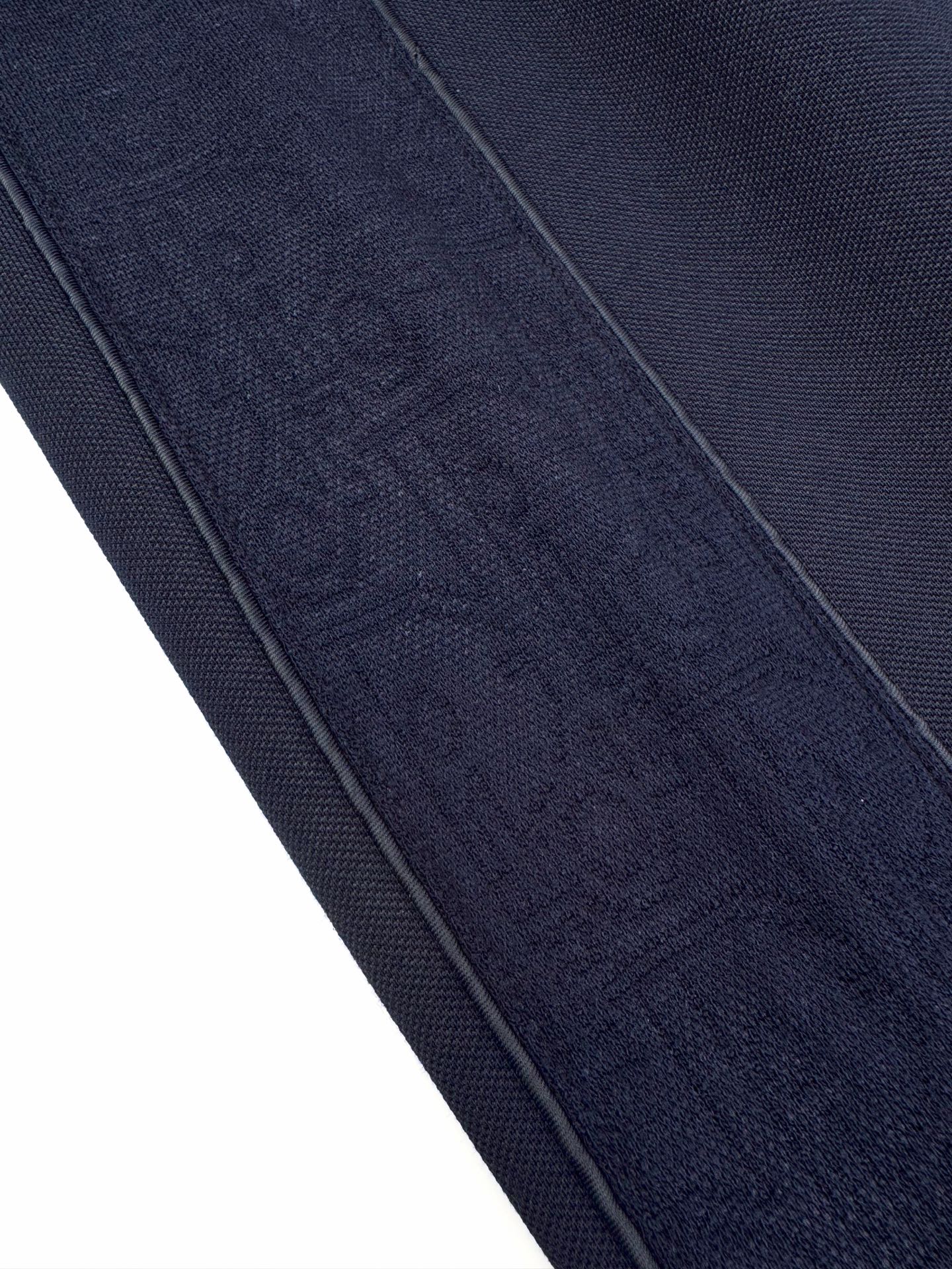 Navy textured woven fabric with visible side seam