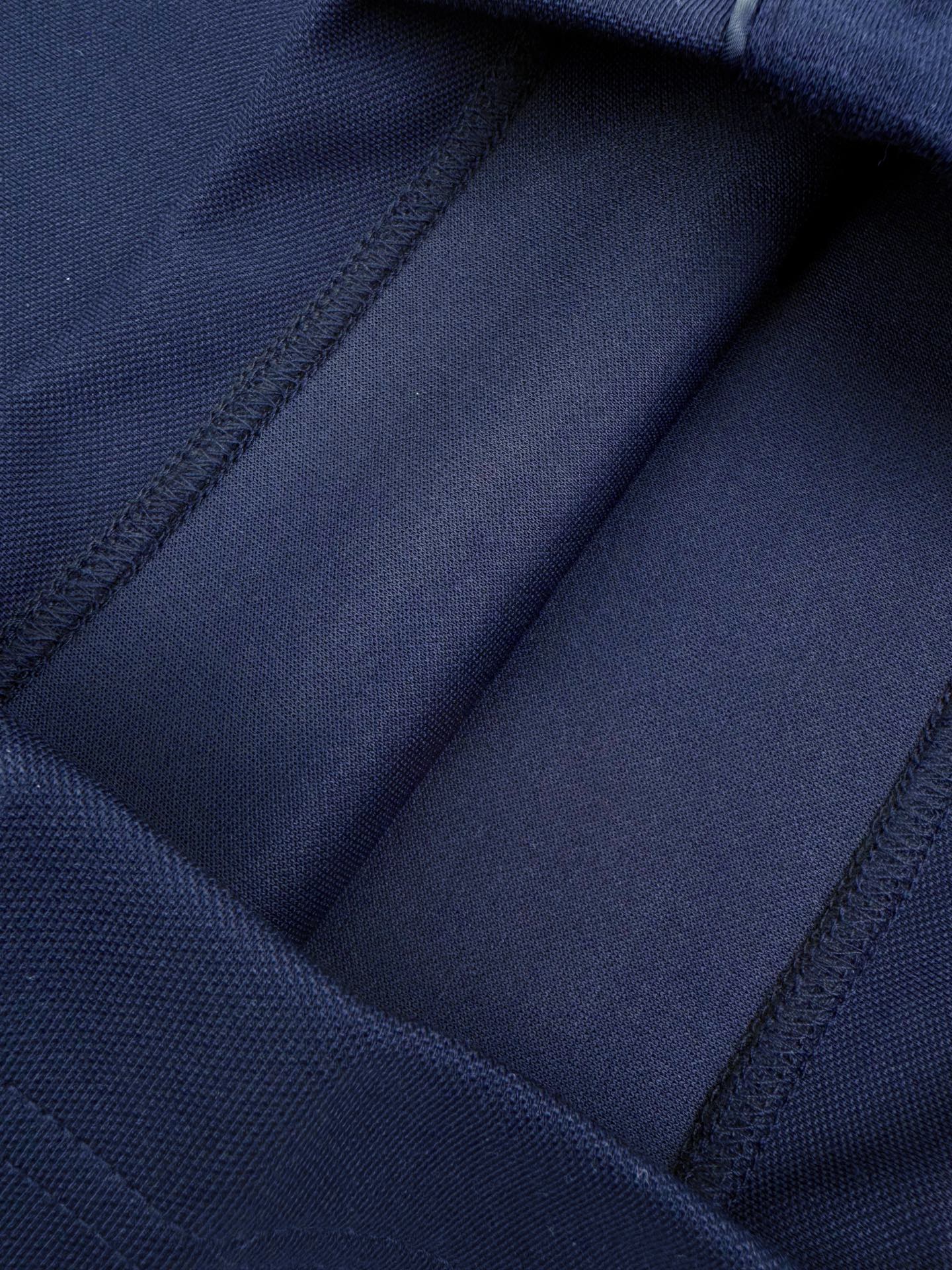 Navy interior pocket and seam stitching detail