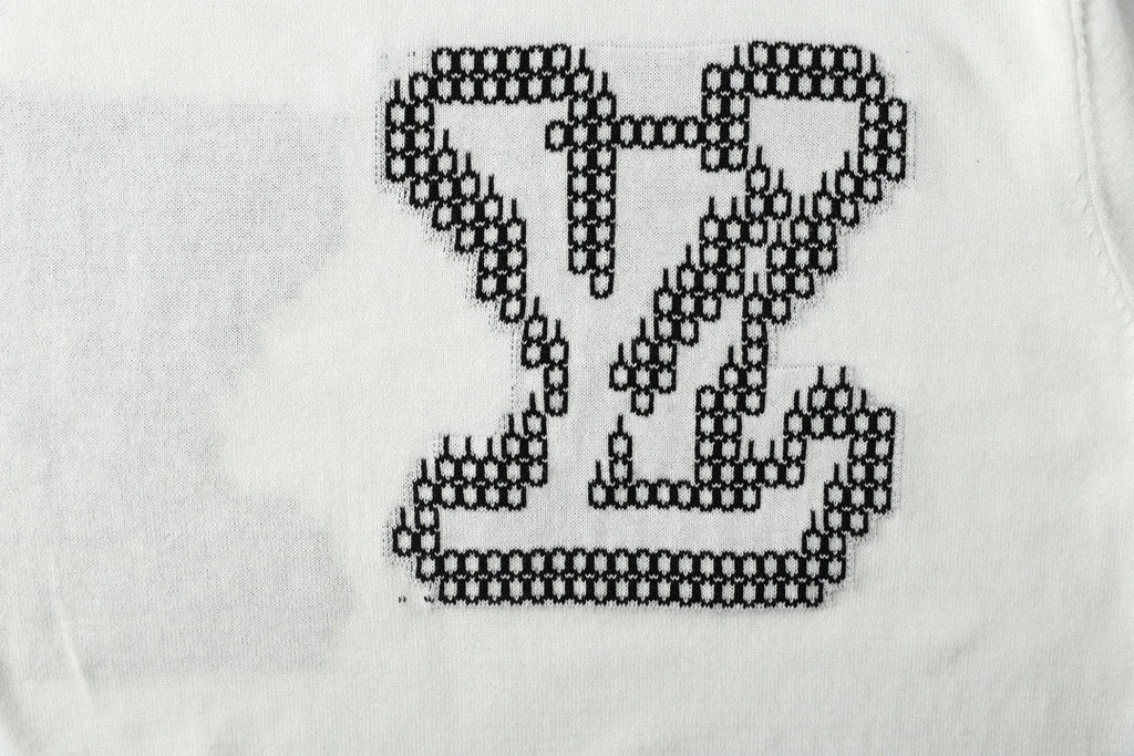 Light blue T-shirt chest graphic with black studded LV heart motif