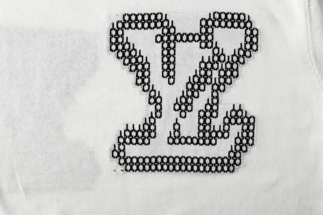 Light blue T-shirt chest graphic with black studded LV heart motif