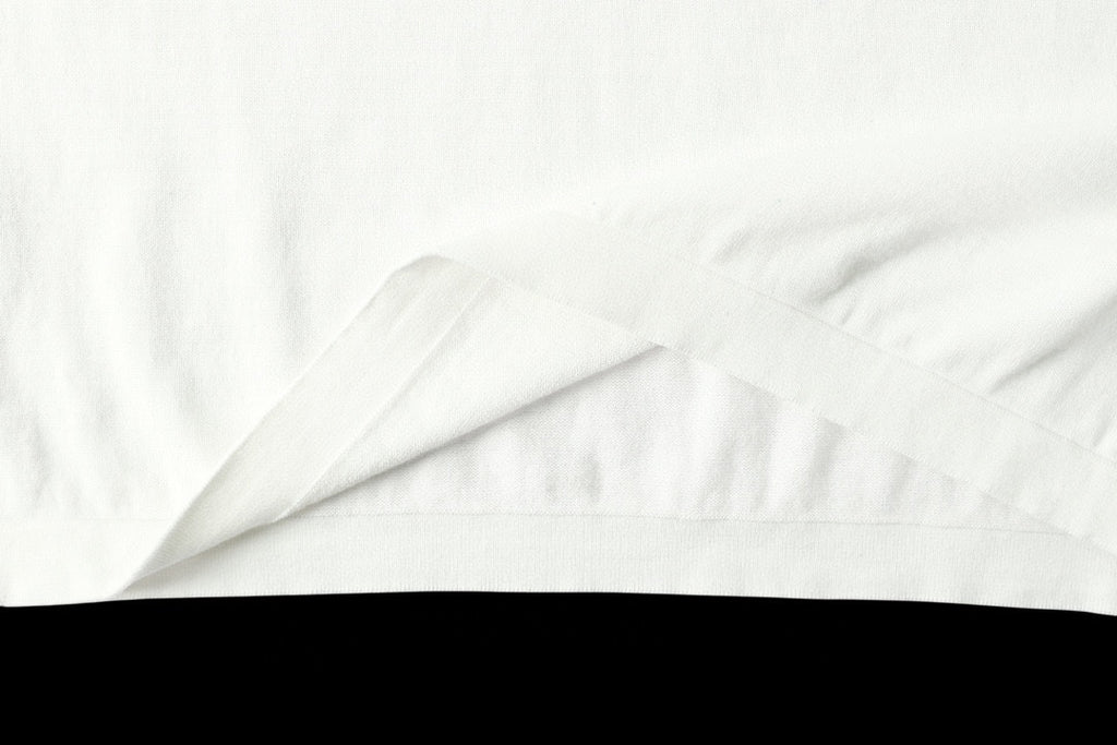 Light blue T-shirt fabric close-up with smooth creases