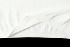 Light blue T-shirt fabric close-up with smooth creases