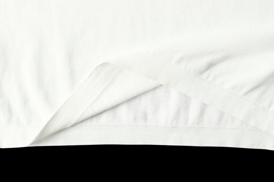 Light blue T-shirt fabric close-up with smooth creases