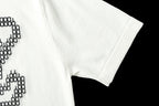 Light blue T-shirt sleeve and hem with partial black LV studded motif