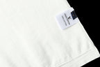 Light blue T-shirt neck label on collar area with fabric texture
