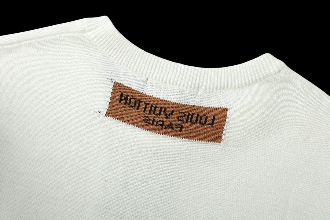 White crewneck T-shirt with brown logo label at the neckline