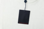 White crewneck T-shirt with hanging navy product tag