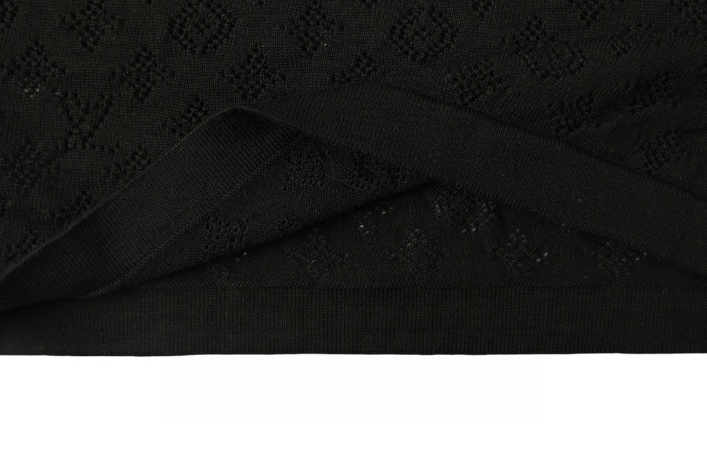 Black T-shirt with subtle monogram pattern and curved hem fold