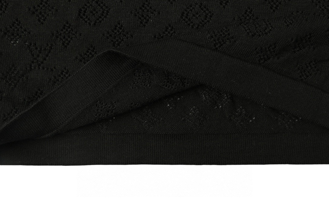 Black T-shirt with subtle monogram pattern and curved hem fold
