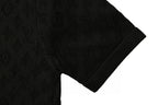 Black short-sleeve T-shirt with subtle monogram pattern and ribbed cuff