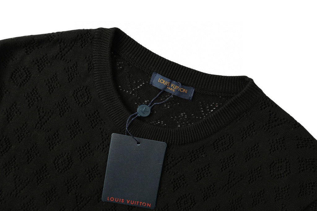 Black crewneck T-shirt neckline detail with logo label and hanging tag