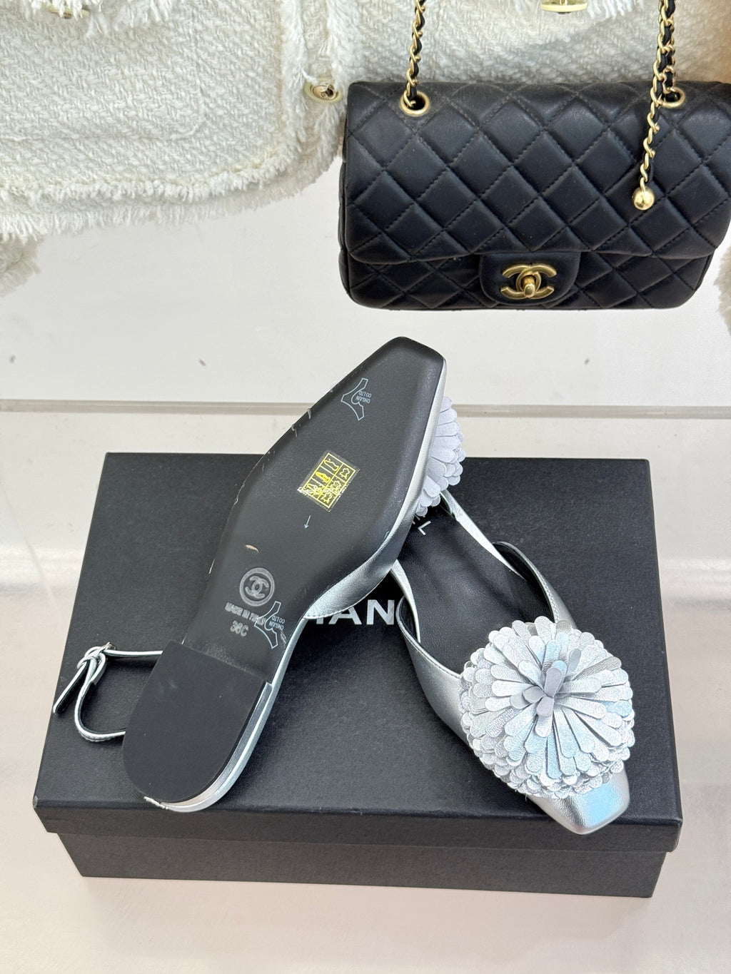 Chanel slingback sandals with white flower embellishment and silver toe strap