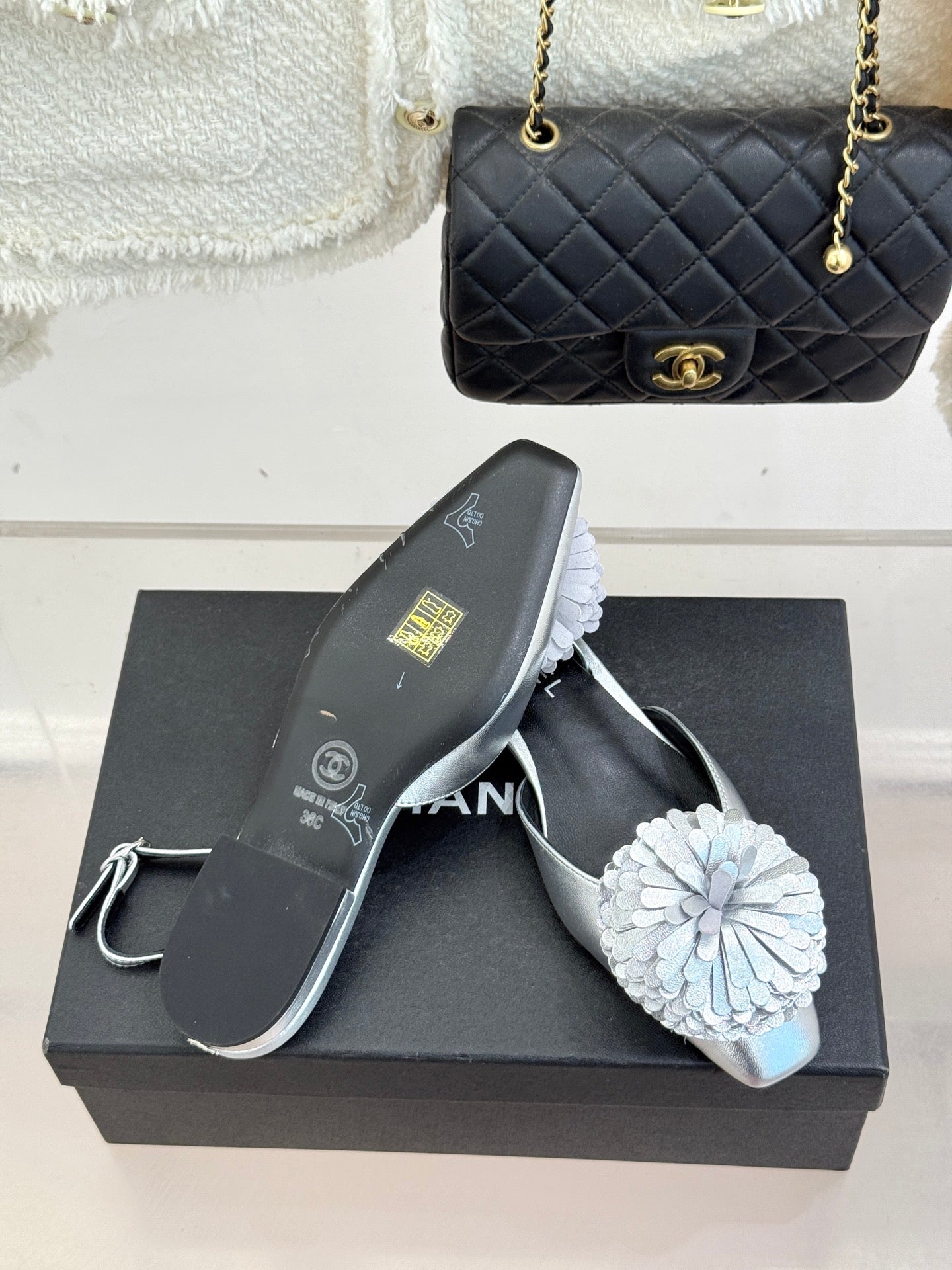 Chanel slingback sandals with white flower embellishment and silver toe strap
